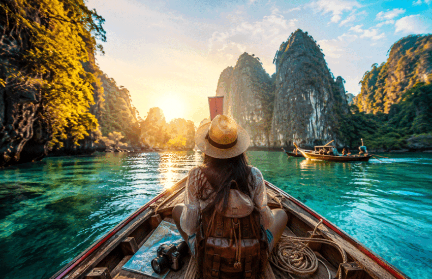 12 Genius Travel Tips You’ll Wish You Knew Earlier traveler exploring a tropical destination by boat during a scenic adventure